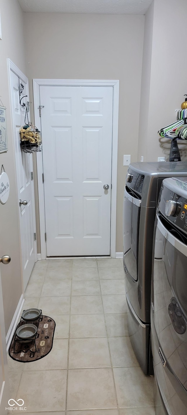 4232 Parliament Way, Avon, IN 46123 - laundry room featuring independent washer and dryer and light tile patterned floors