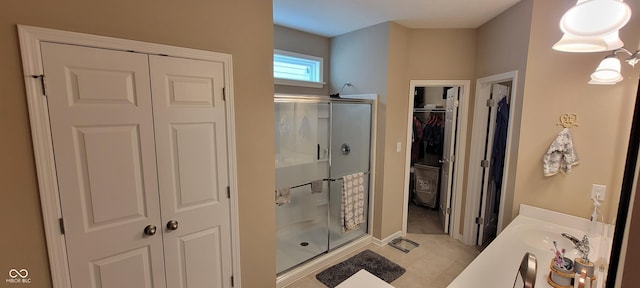 4232 Parliament Way, Avon, IN 46123 - bathroom with a shower stall, vanity, tile patterned flooring, a walk in closet, and baseboards