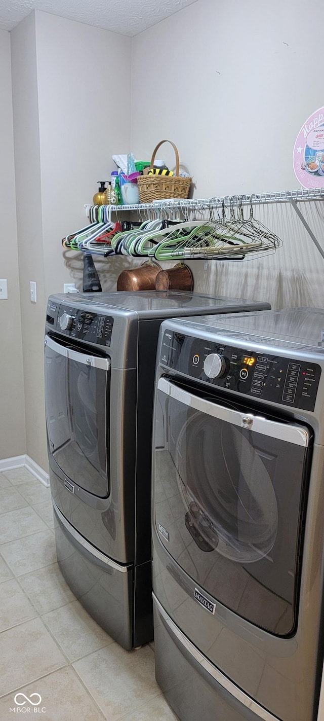 4232 Parliament Way, Avon, IN 46123 - laundry room featuring independent washer and dryer and light tile patterned flooring