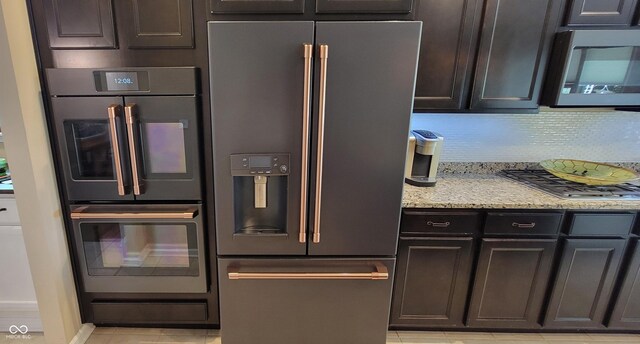 4232 Parliament Way, Avon, IN 46123 - kitchen with stainless steel appliances, light tile patterned flooring, light stone counters, and tasteful backsplash