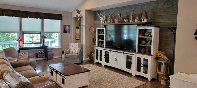 4232 Parliament Way, Avon, IN 46123 - living area with vaulted ceiling, dark wood-type flooring, and baseboards