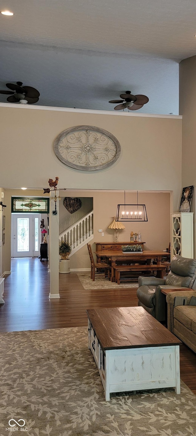 4232 Parliament Way, Avon, IN 46123 - living room featuring wood finished floors, ceiling fan, a chandelier, and baseboards
