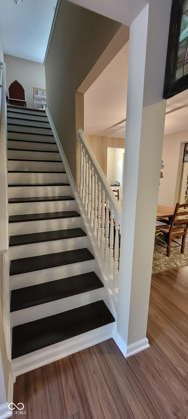 4232 Parliament Way, Avon, IN 46123 - stairway with wood finished floors and baseboards