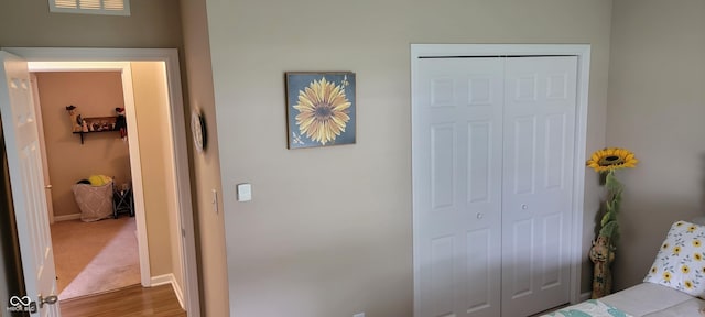 4232 Parliament Way, Avon, IN 46123 - bedroom with a closet, wood finished floors, and baseboards