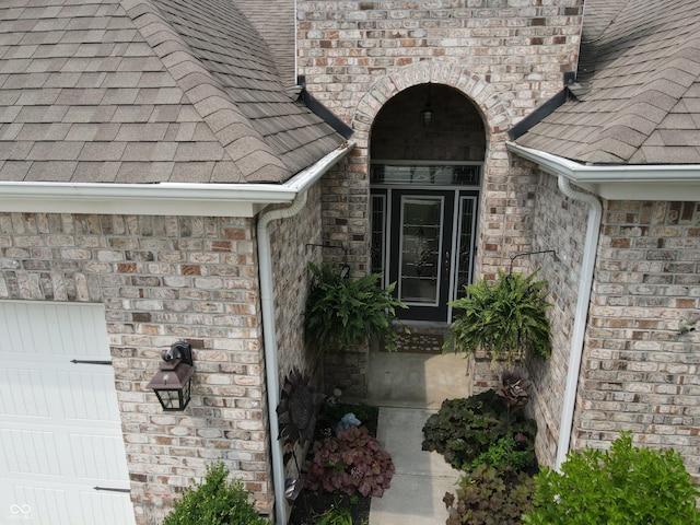 4232 Parliament Way, Avon, IN 46123 - entrance to property with roof with shingles, brick siding, and an attached garage