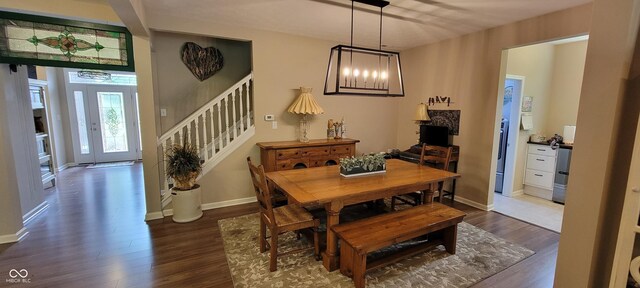 4232 Parliament Way, Avon, IN 46123 - dining room with wood finished floors, stairway, a chandelier, and baseboards