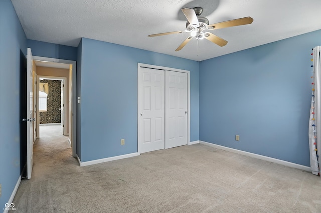 10410 Trillium Ct, Noblesville, IN 46060 - unfurnished bedroom featuring carpet, baseboards, a closet, and a textured ceiling