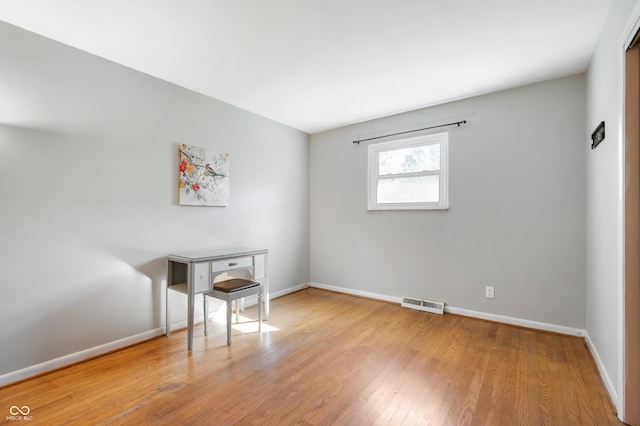 1325 Alimingo Dr, Indianapolis, IN 46260 - spare room with wood finished floors and baseboards