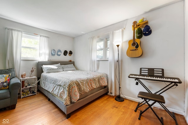 1325 Alimingo Dr, Indianapolis, IN 46260 - bedroom featuring multiple windows and light wood-style flooring