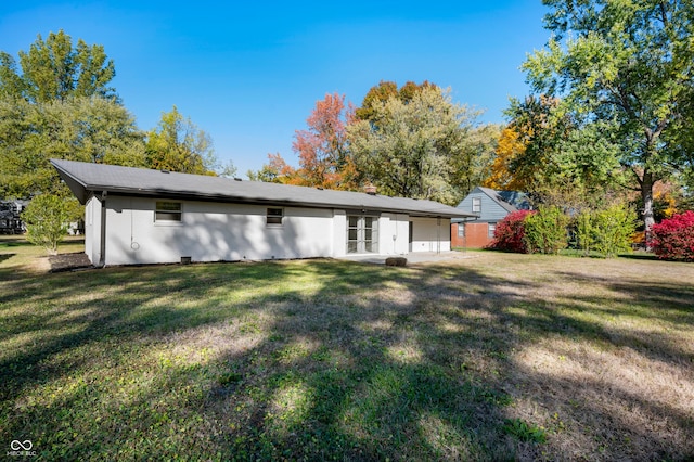 1325 Alimingo Dr, Indianapolis, IN 46260 - rear view of property with a lawn and french doors