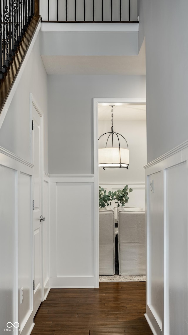 478 Firefly Ln, Carmel, IN 46032 - hall with a wainscoted wall, wood finished floors, and a decorative wall