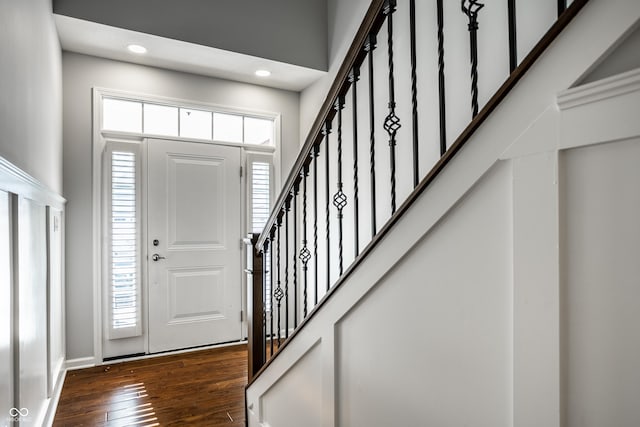 478 Firefly Ln, Carmel, IN 46032 - entrance foyer featuring dark wood-type flooring, stairs, baseboards, recessed lighting, and a high ceiling