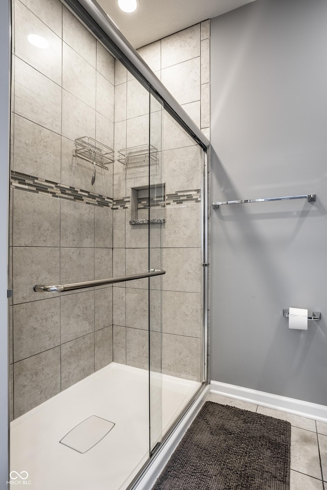 478 Firefly Ln, Carmel, IN 46032 - full bathroom featuring a shower stall, tile patterned floors, and baseboards