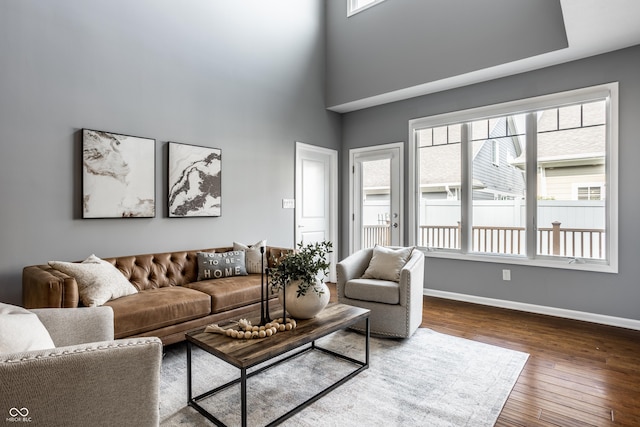 478 Firefly Ln, Carmel, IN 46032 - living area featuring baseboards, dark wood-style flooring, and a high ceiling