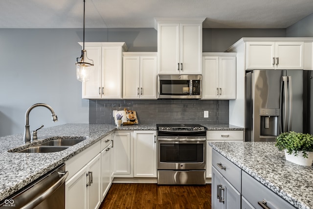 478 Firefly Ln, Carmel, IN 46032 - kitchen featuring appliances with stainless steel finishes, a sink, dark wood finished floors, and white cabinets