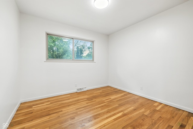 6704 Hoover Rd, Indianapolis, IN 46260 - empty room with light wood finished floors and baseboards