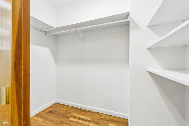 6704 Hoover Rd, Indianapolis, IN 46260 - walk in closet featuring wood finished floors