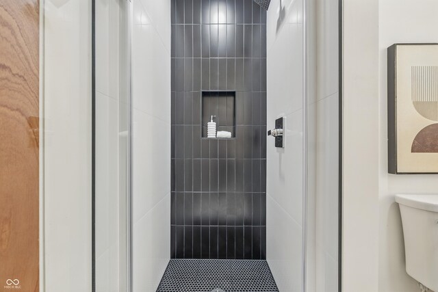6704 Hoover Rd, Indianapolis, IN 46260 - bathroom featuring tiled shower and toilet