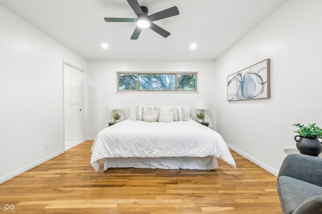 6704 Hoover Rd, Indianapolis, IN 46260 - bedroom featuring baseboards, light wood-style floors, recessed lighting, and a ceiling fan