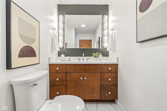 6704 Hoover Rd, Indianapolis, IN 46260 - bathroom with toilet, vanity, and baseboards
