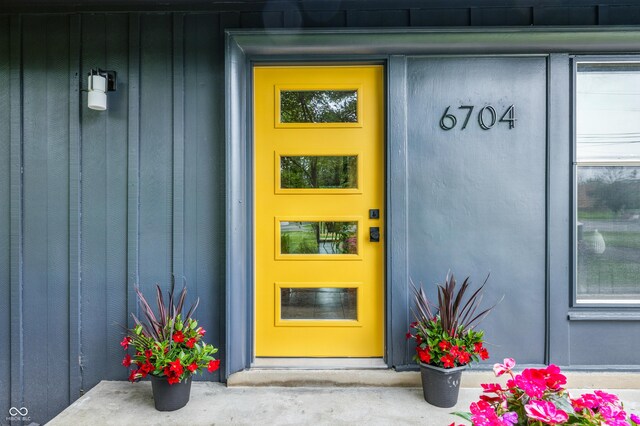 6704 Hoover Rd, Indianapolis, IN 46260 - property entrance with board and batten siding