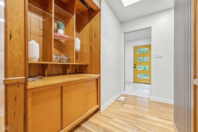 6704 Hoover Rd, Indianapolis, IN 46260 - interior space featuring baseboards, a skylight, and light wood-style flooring