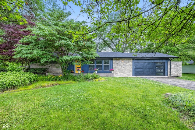 6704 Hoover Rd, Indianapolis, IN 46260 - mid-century modern home featuring stone siding, driveway, an attached garage, and a front lawn