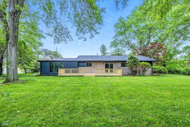 6704 Hoover Rd, Indianapolis, IN 46260 - rear view of house featuring a deck and a yard
