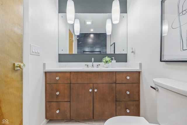 6704 Hoover Rd, Indianapolis, IN 46260 - bathroom with toilet, vanity, and baseboards