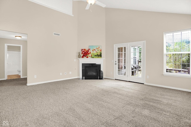 13528 Cuppertino Ln, Carmel, IN 46074 - unfurnished living room featuring a fireplace with flush hearth, high vaulted ceiling, a ceiling fan, and carpet