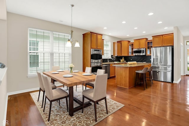 13528 Cuppertino Ln, Carmel, IN 46074 - dining area featuring wood finished floors and recessed lighting