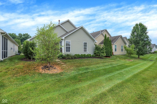 13528 Cuppertino Ln, Carmel, IN 46074 - view of property exterior with a lawn