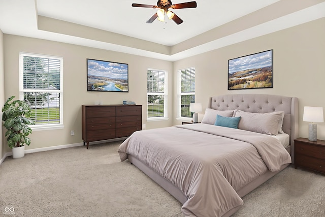 13528 Cuppertino Ln, Carmel, IN 46074 - bedroom featuring light colored carpet, a raised ceiling, and a ceiling fan
