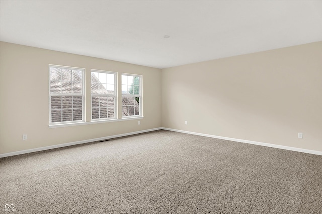 13528 Cuppertino Ln, Carmel, IN 46074 - spare room featuring baseboards and carpet flooring