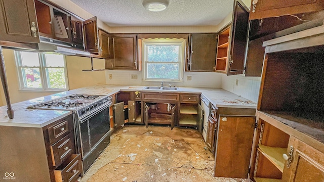 3215 E 10th St, Anderson, IN 46012 - kitchen featuring black gas stove, a textured ceiling, a sink, backsplash, and light countertops