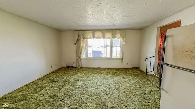 3215 E 10th St, Anderson, IN 46012 - carpeted empty room featuring a textured ceiling