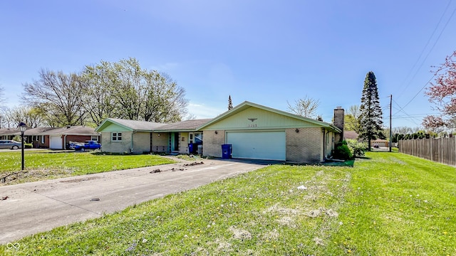 3215 E 10th St, Anderson, IN 46012 - ranch-style home with a garage, brick siding, a chimney, and driveway