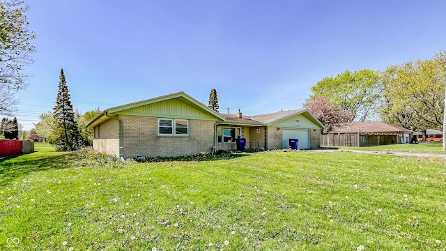 3215 E 10th St, Anderson, IN 46012 - ranch-style home featuring brick siding and a garage
