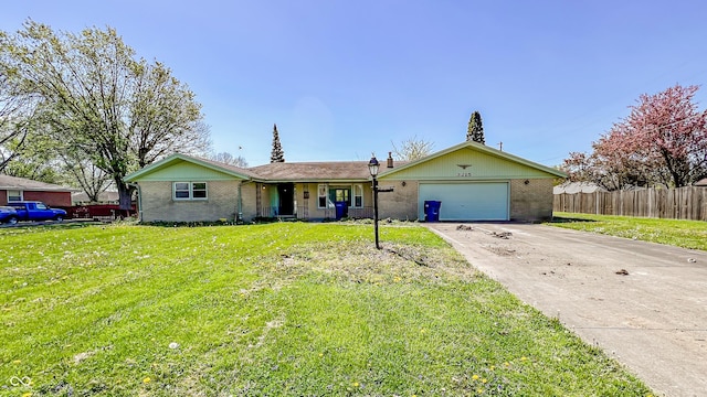 3215 E 10th St, Anderson, IN 46012 - ranch-style home featuring brick siding, asphalt driveway, and a garage