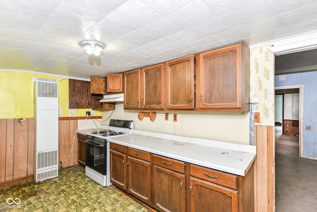 2009 S L St, Elwood, IN 46036 - kitchen featuring gas range gas stove, under cabinet range hood, a heating unit, light countertops, and tile patterned floors