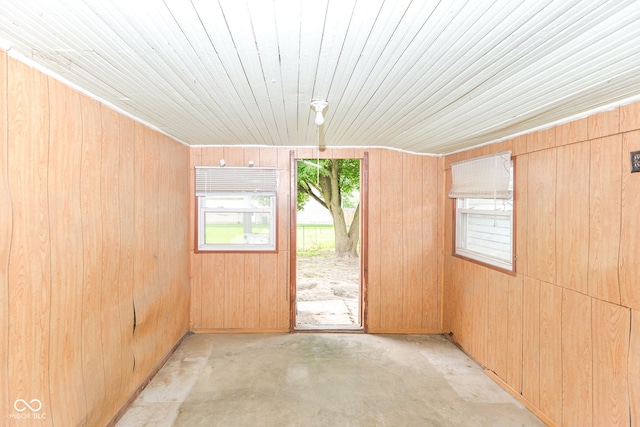2009 S L St, Elwood, IN 46036 - unfurnished room featuring concrete flooring, wood walls, and wood ceiling