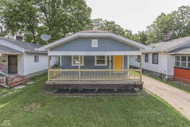 2945 N Denny St, Indianapolis, IN 46218 - view of front of home with covered porch and a front yard