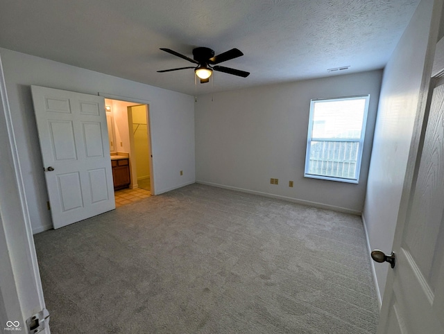 581 Grassy Bend Dr, Greenwood, IN 46143 - unfurnished bedroom with light colored carpet, baseboards, and ceiling fan