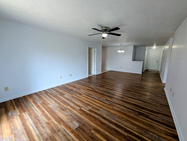 581 Grassy Bend Dr, Greenwood, IN 46143 - spare room with a ceiling fan, dark wood-style flooring, baseboards, and a textured ceiling
