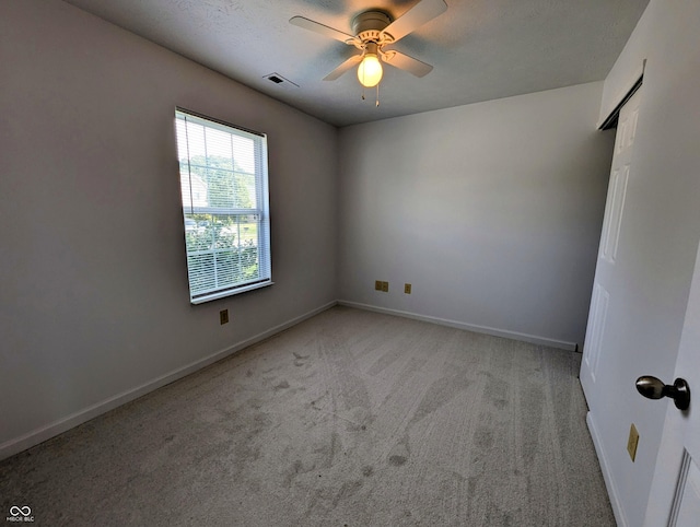 581 Grassy Bend Dr, Greenwood, IN 46143 - spare room with light carpet, ceiling fan, and baseboards