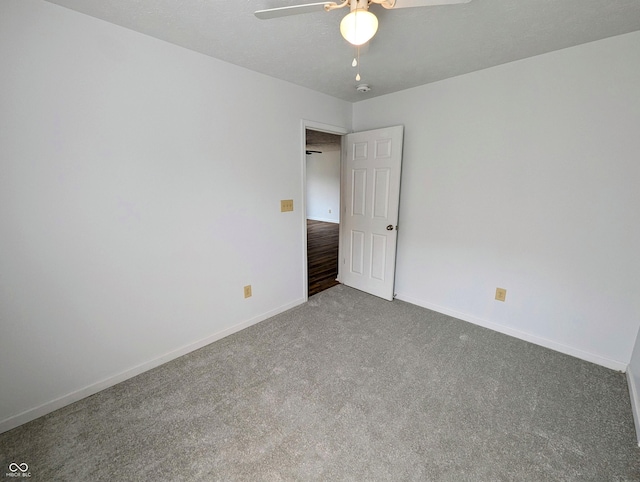581 Grassy Bend Dr, Greenwood, IN 46143 - spare room with a ceiling fan, carpet flooring, and baseboards