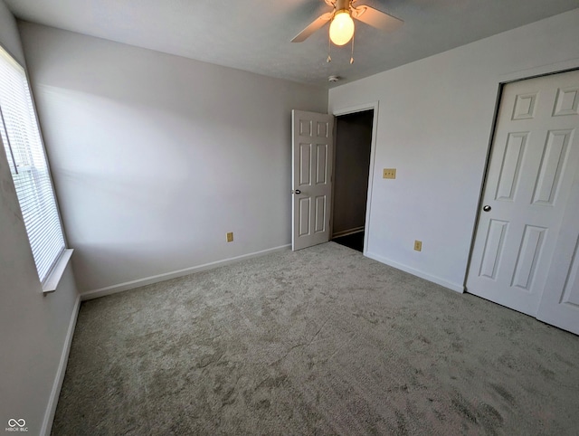 581 Grassy Bend Dr, Greenwood, IN 46143 - unfurnished bedroom with carpet floors, baseboards, and a ceiling fan