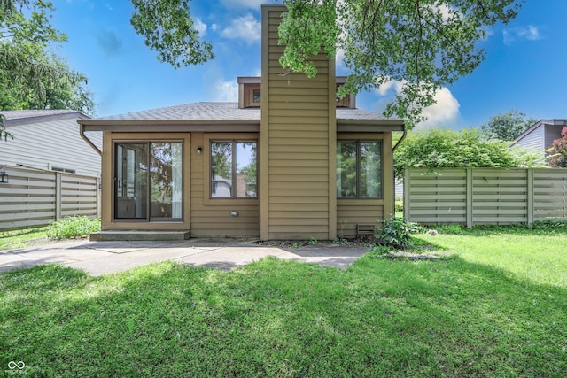 4462 Carya Sq, Columbus, IN 47201 - back of property with a chimney and roof with shingles