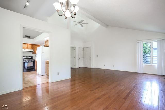 4462 Carya Sq, Columbus, IN 47201 - unfurnished living room featuring a chandelier, ceiling fan, wood-type flooring, high vaulted ceiling, and baseboards