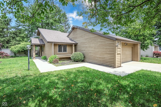 4462 Carya Sq, Columbus, IN 47201 - view of front of house with a front lawn, concrete driveway, a shingled roof, and an attached garage